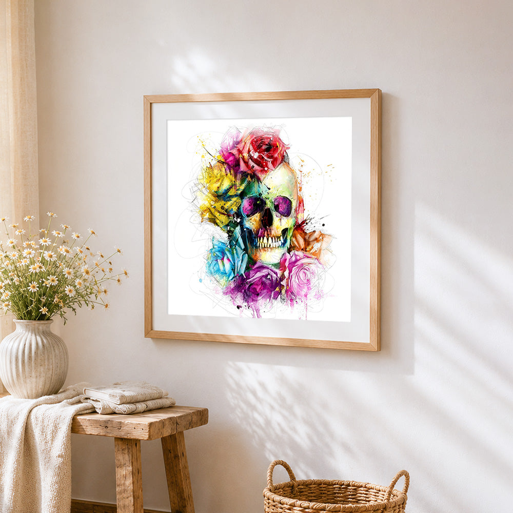 Vibrant watercolour skull and roses cross stitch artwork displayed on wall as home decor
