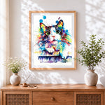 Finished vibrant watercolour splash cat cross stitch artwork displayed