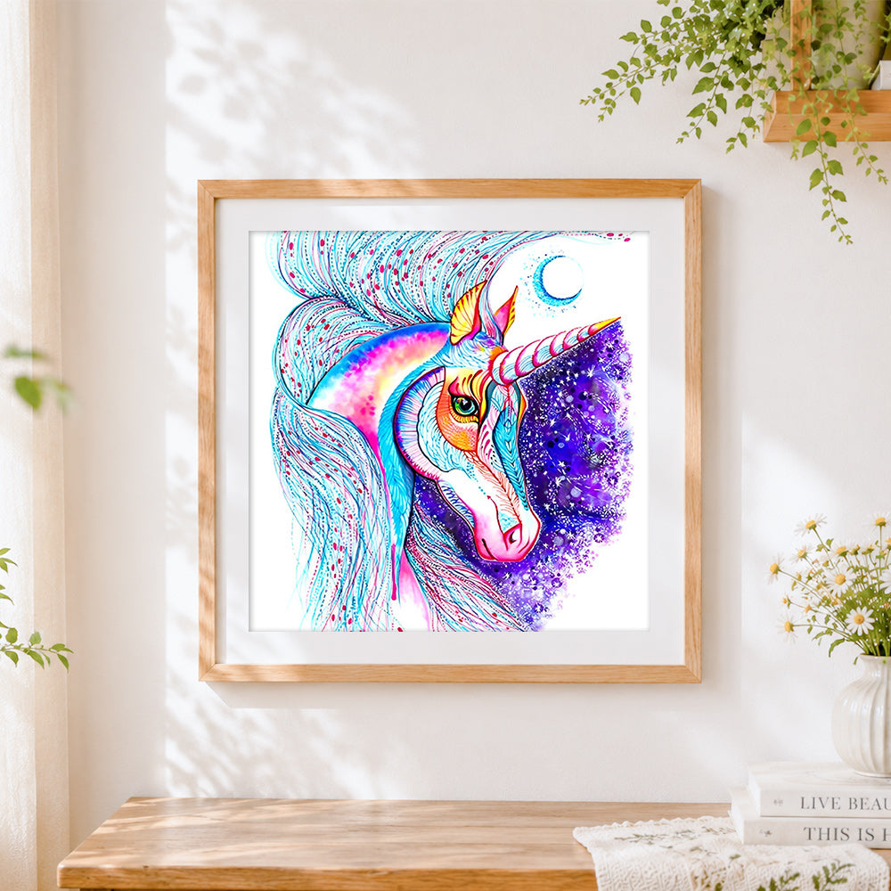 Finished vibrant watercolour unicorn with moon cross stitch artwork displayed