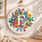 Vibrant wildflowers and letter e embroidery hoop wall art displayed as warm and cosy handmade home decor
