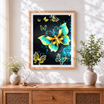Finished vibrant yellow and green butterflies cross stitch artwork displayed