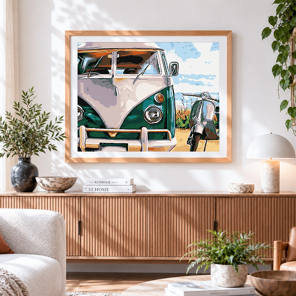 Finished vintage camper van and scooter cross stitch artwork displayed