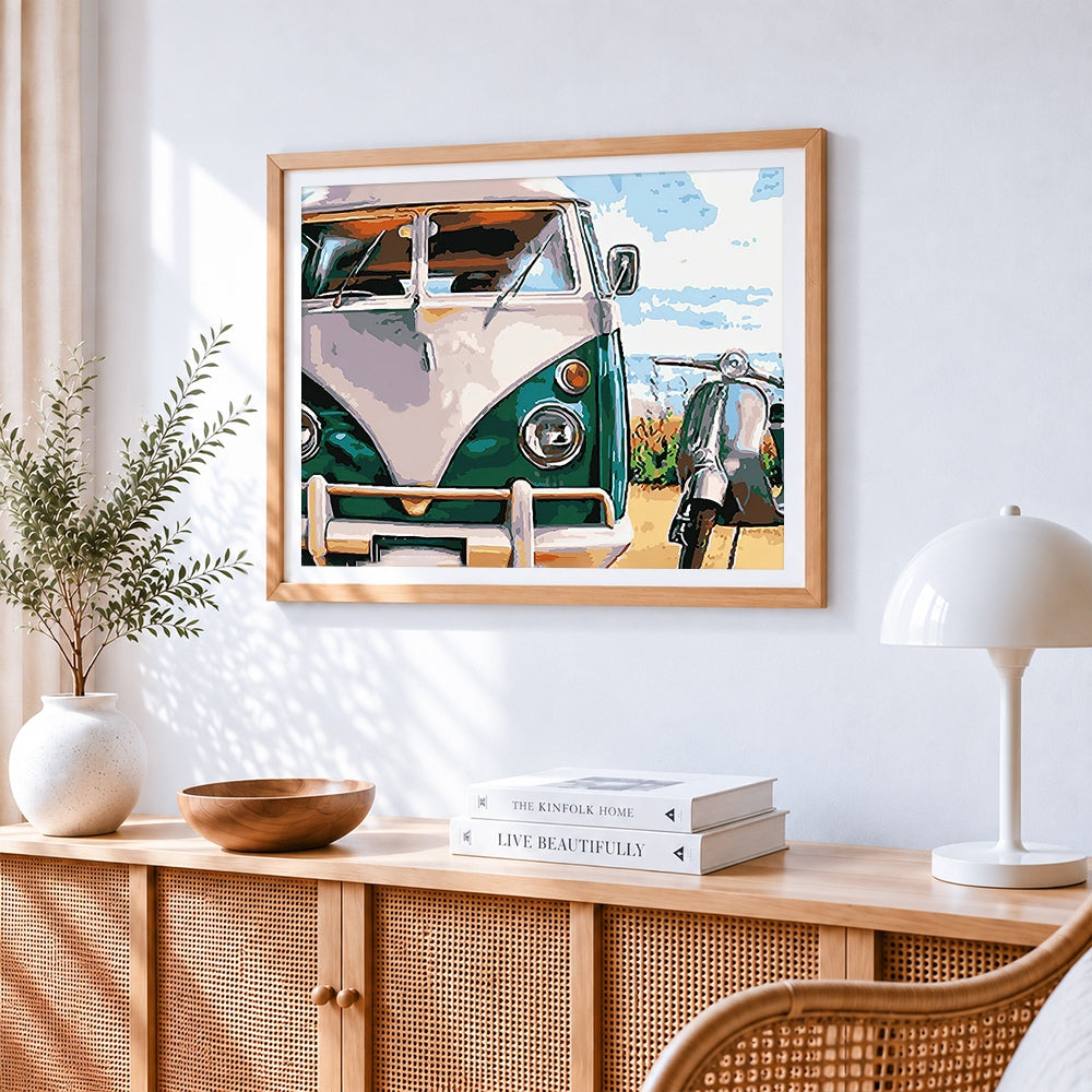 Vintage camper van and scooter cross stitch artwork displayed on wall as home decor