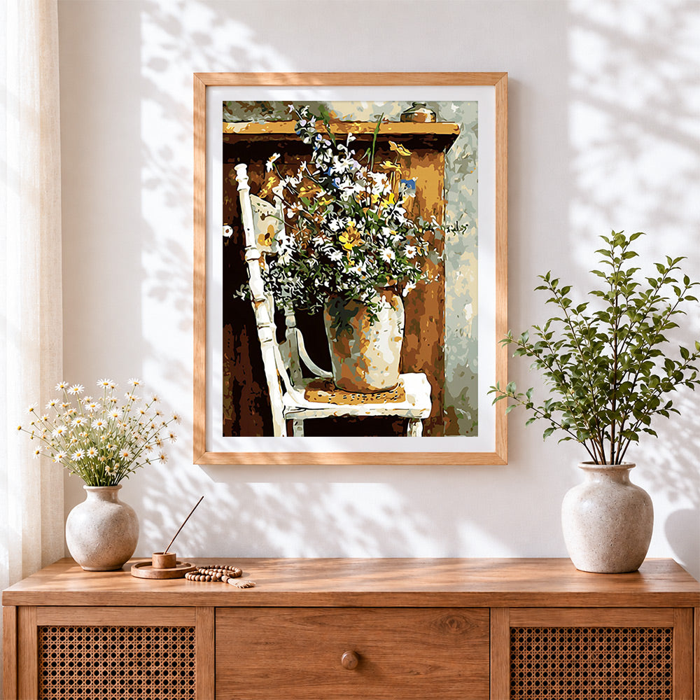 Finished vintage daisy still life cross stitch artwork displayed