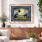 Finished vintage haunted halloween cauldron with black cats cross stitch artwork displayed