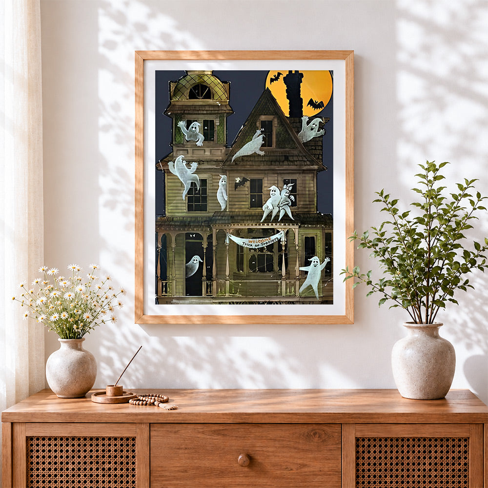 Finished vintage haunted house with ghosts cross stitch artwork displayed