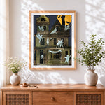 Finished vintage haunted house with ghosts cross stitch artwork displayed