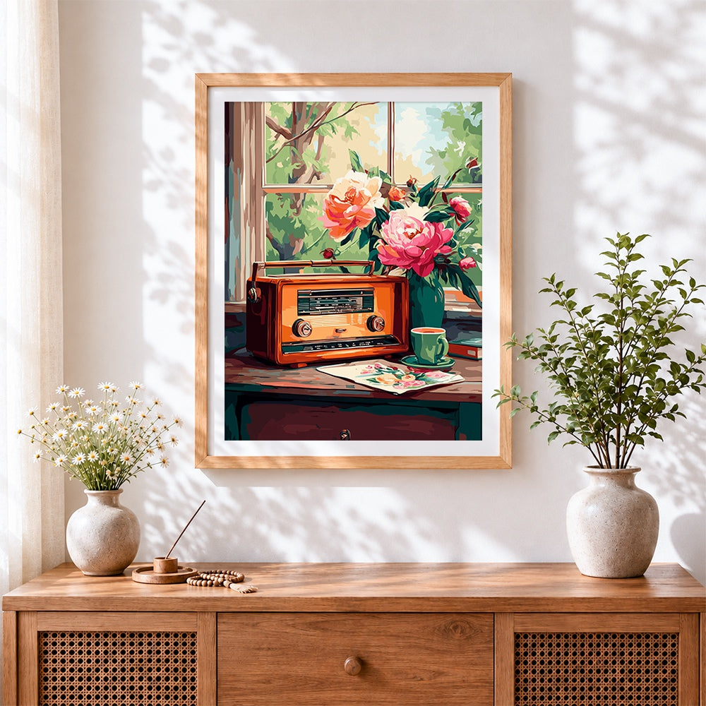 Finished vintage radio and peonies cross stitch artwork displayed