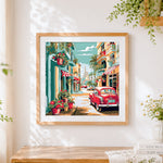 Finished vintage red car on a tropical street cross stitch artwork displayed