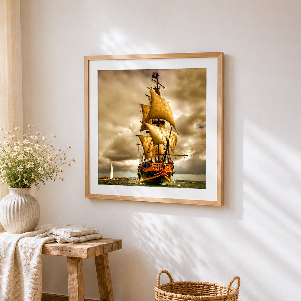 Vintage sailing ship cross stitch artwork displayed on wall as home decor
