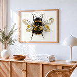 Vintage style bee with flowers cross stitch artwork displayed on wall as home decor