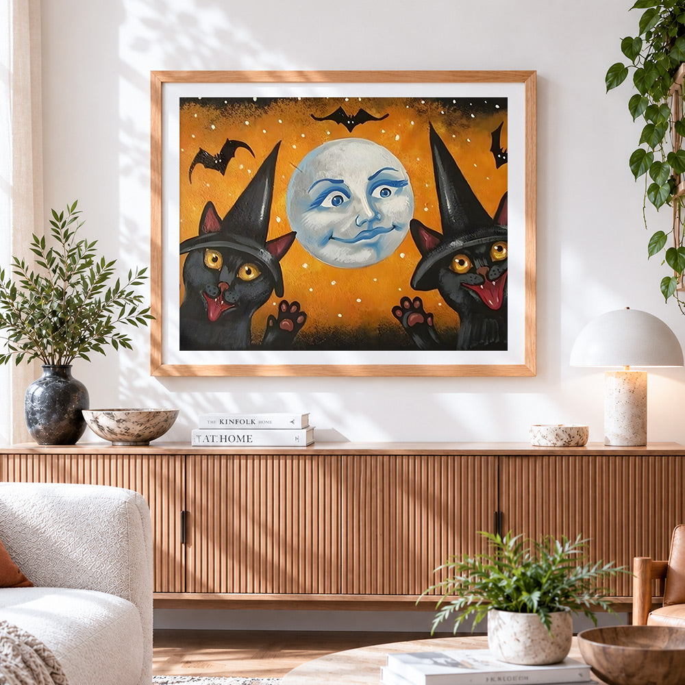Finished vintage style black cats and batty moon cross stitch artwork displayed
