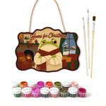 Warm indoor holiday paint by numbers door hanger with paints and brushes