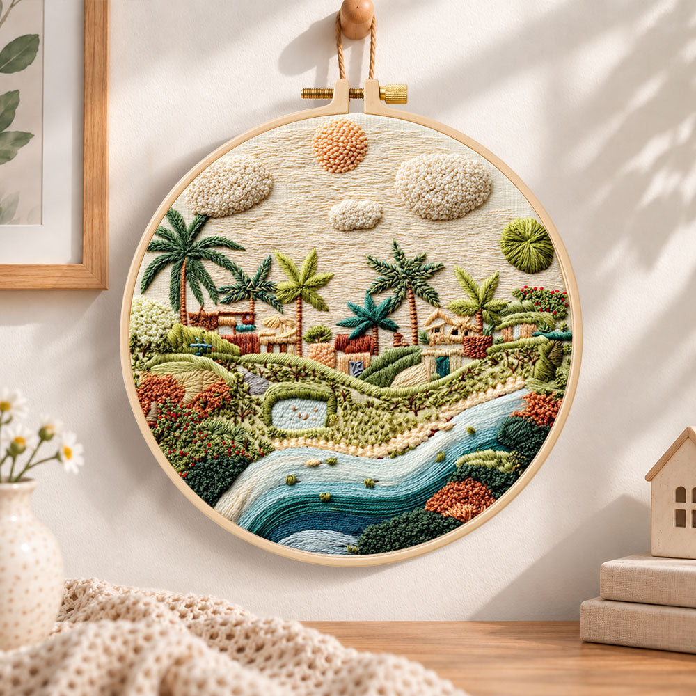Warm sunlit village embroidery hoop wall art displayed as warm and cosy handmade home decor