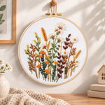 Warm tone dried florals embroidery hoop wall art displayed as warm and cosy handmade home decor