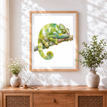 Finished watercolour chameleon cross stitch artwork displayed