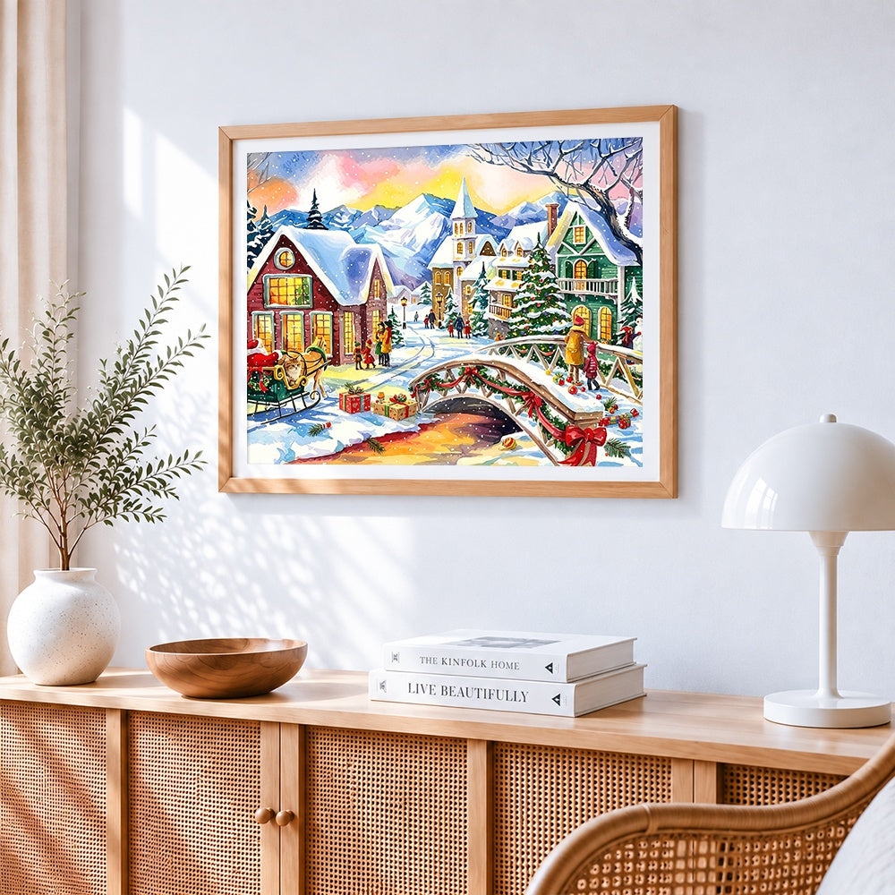 Watercolour christmas village with bridge cross stitch artwork displayed on wall as home decor