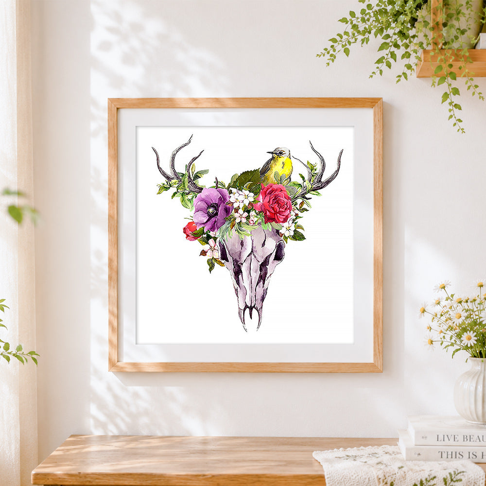 Finished watercolour deer skull with bird and flowers cross stitch artwork displayed