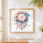 Finished watercolour floral dreamcatcher cross stitch artwork displayed