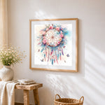 Watercolour floral dreamcatcher cross stitch artwork displayed on wall as home decor