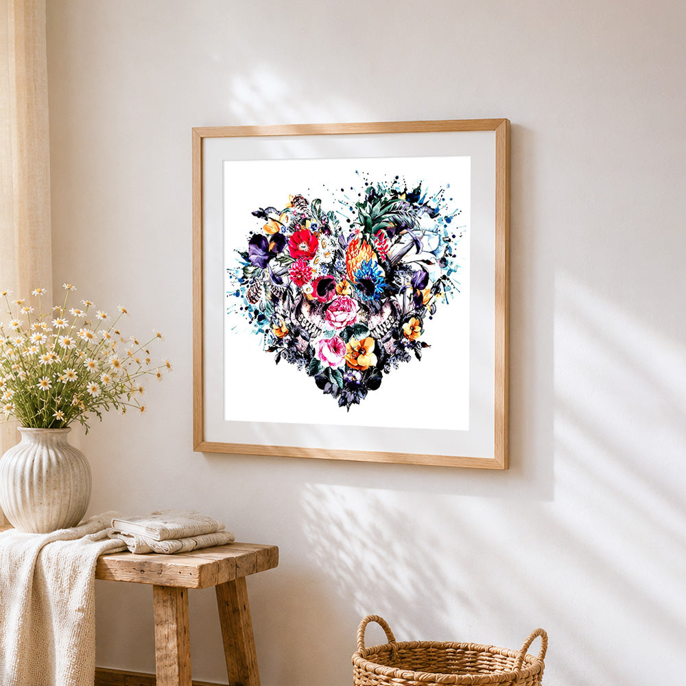 Watercolour floral heart skulls cross stitch artwork displayed on wall as home decor