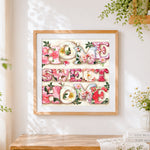 Finished watercolour floral home sweet home print cross stitch artwork displayed