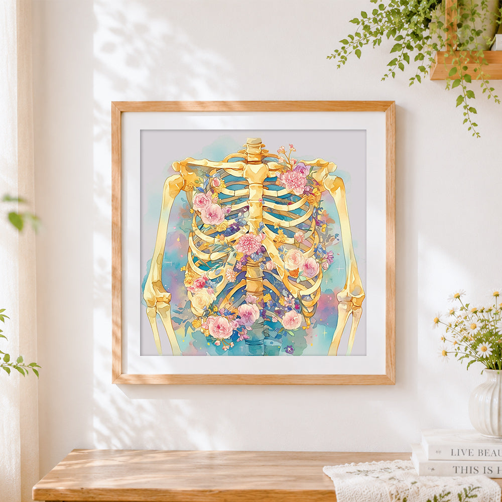 Finished watercolour floral ribcage cross stitch artwork displayed