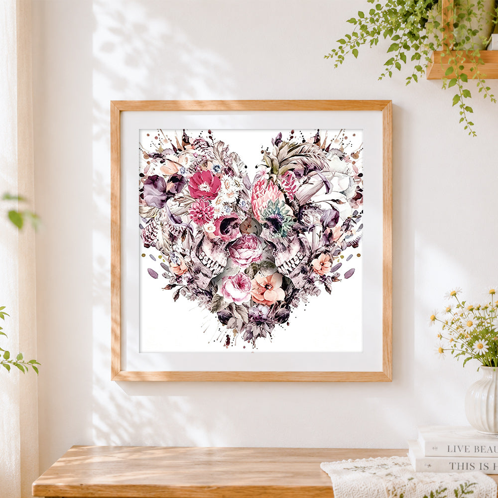 Finished watercolour floral skulls cross stitch artwork displayed