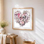 Watercolour floral skulls cross stitch artwork displayed on wall as home decor