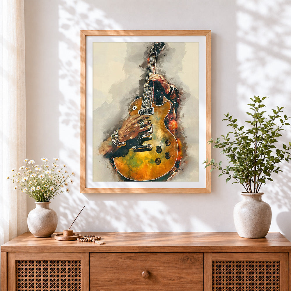 Finished watercolour guitarist cross stitch artwork displayed