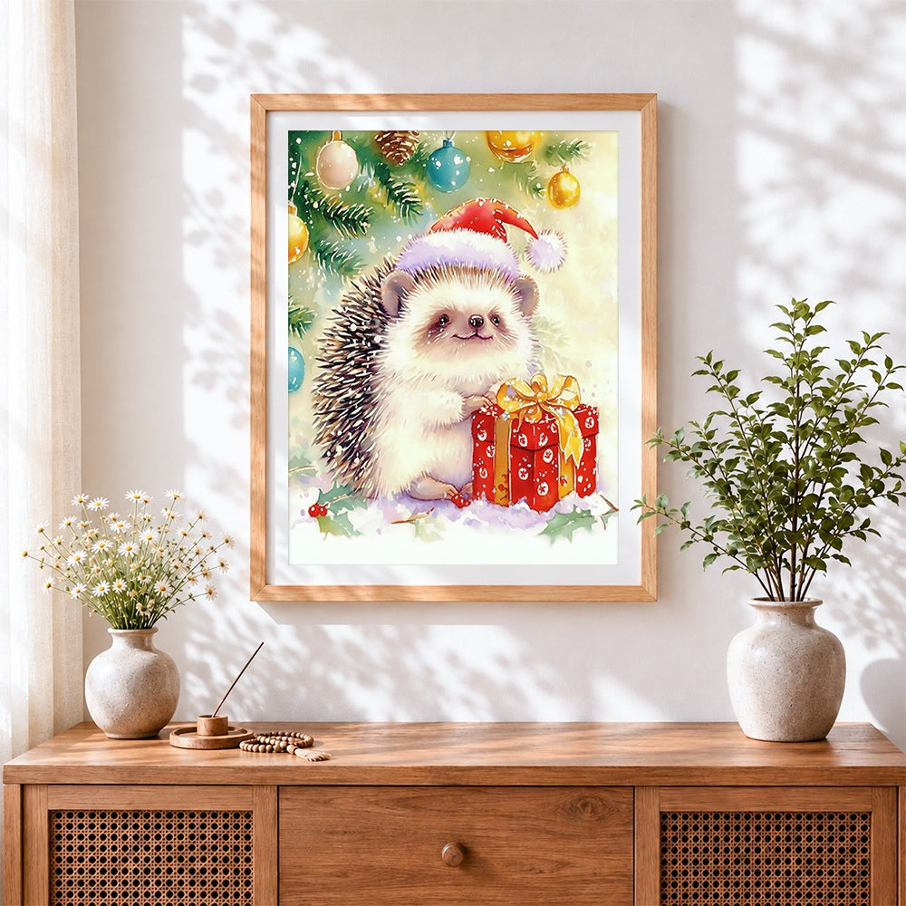 Finished watercolour hedgehog with christmas gift cross stitch artwork displayed