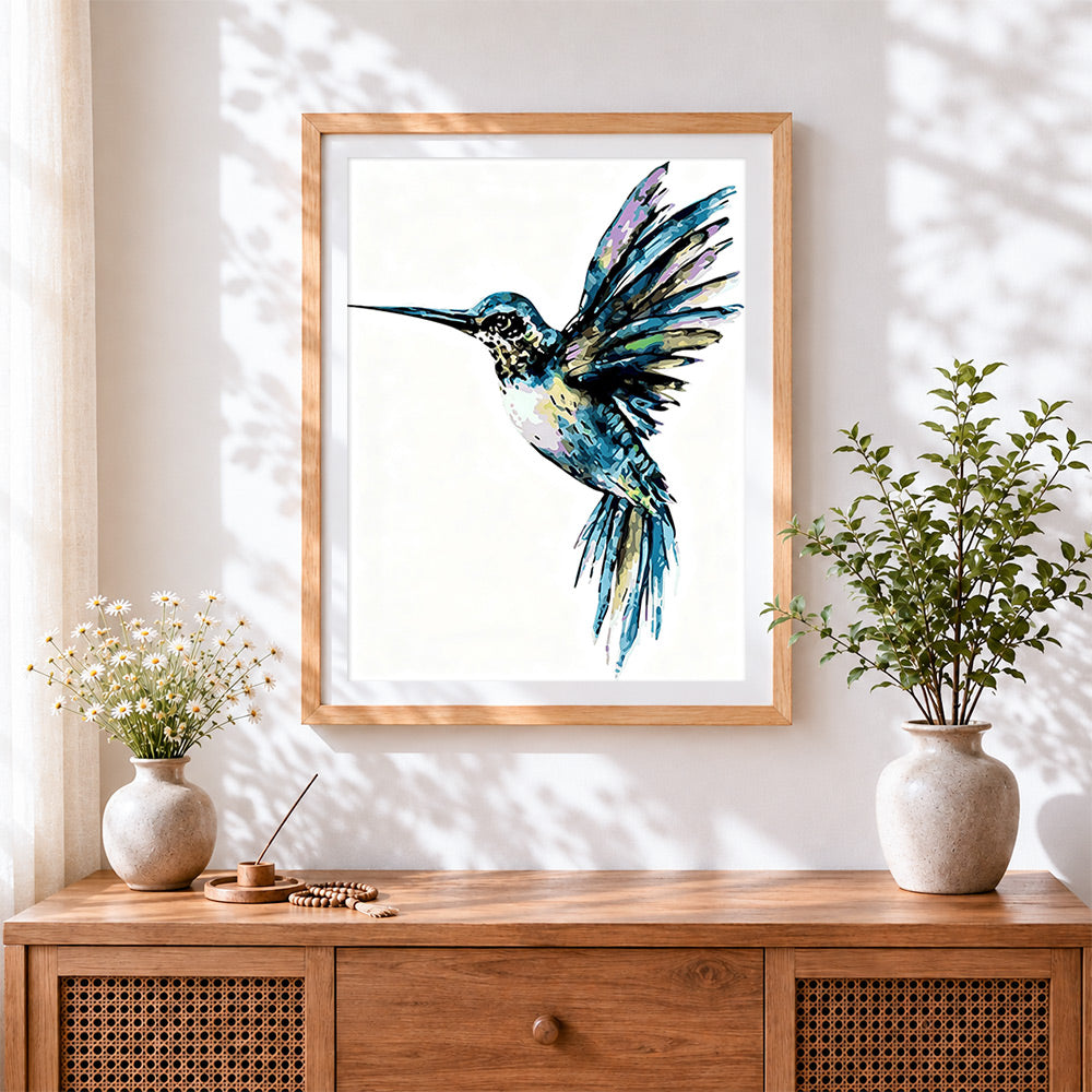 Finished watercolour hummingbird cross stitch artwork displayed
