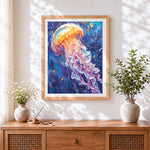 Finished watercolour jellyfish in ocean blue cross stitch artwork displayed