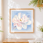 Finished watercolour magnolia flower cross stitch artwork displayed