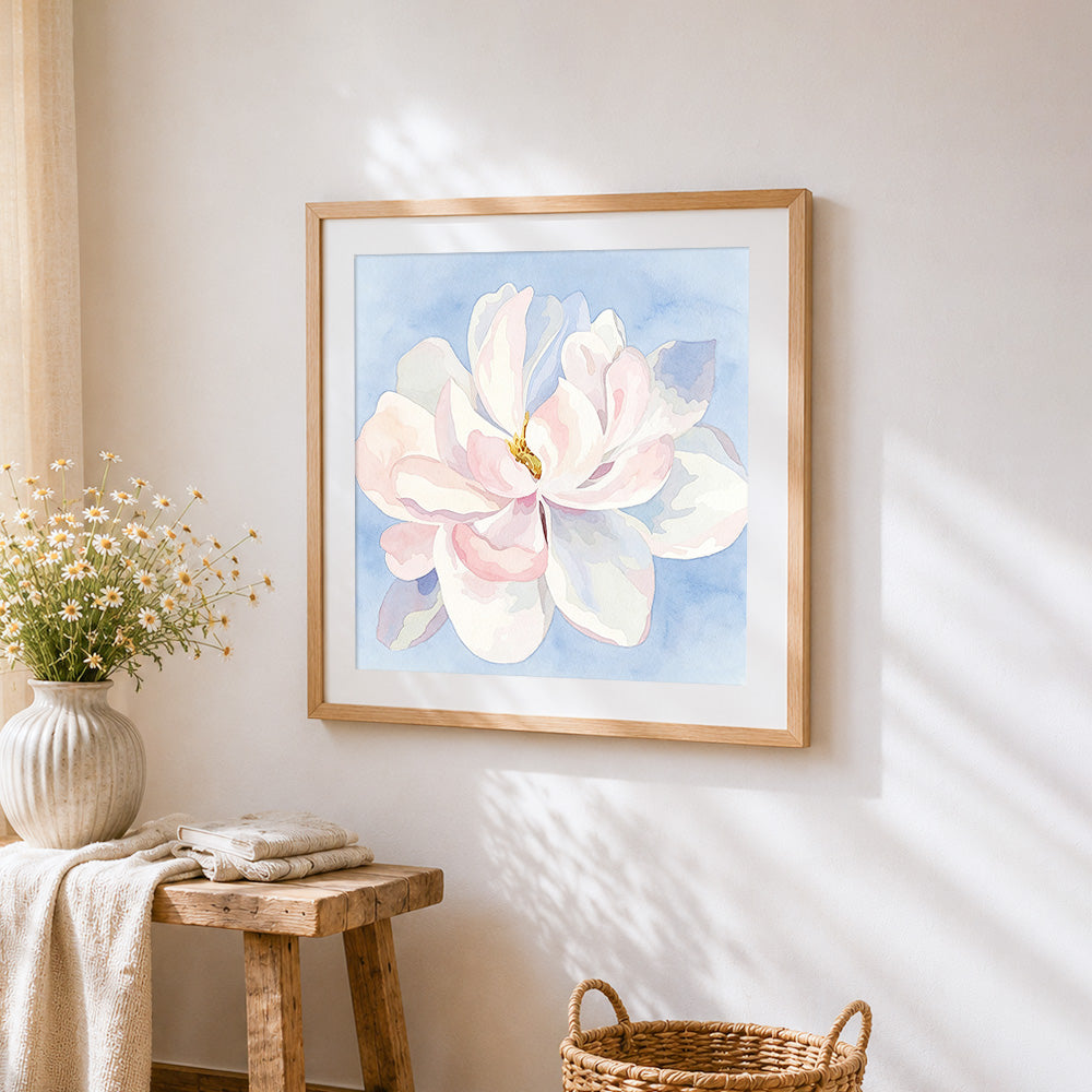 Watercolour magnolia flower cross stitch artwork displayed on wall as home decor
