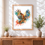 Finished watercolour owl in flight cross stitch artwork displayed