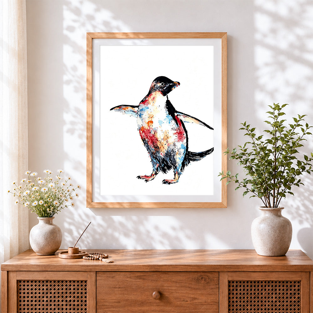 Finished watercolour penguin cross stitch artwork displayed