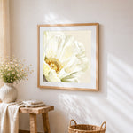 Watercolour peony in cream cross stitch artwork displayed on wall as home decor