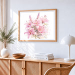 Watercolour pink lilies cross stitch artwork displayed on wall as home decor