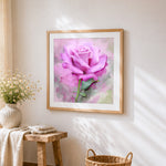 Watercolour pink rose cross stitch artwork displayed on wall as home decor