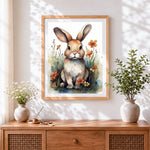 Finished watercolour rabbit in a wildflower meadow cross stitch artwork displayed