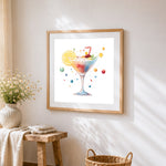 Watercolour rainbow cocktail cross stitch artwork displayed on wall as home decor