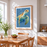 Watercolour sea turtle splatter cross stitch artwork displayed on wall as home decor