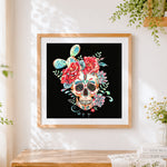 Finished watercolour skull with cacti and flowers cross stitch artwork displayed