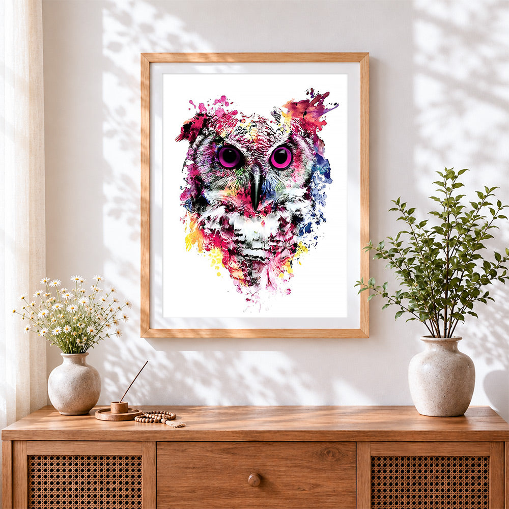 Finished watercolour splash owl cross stitch artwork displayed