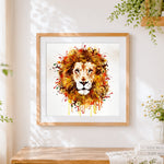 Finished watercolour splatter lion cross stitch artwork displayed