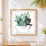 Finished watercolour succulent plants in a pot cross stitch artwork displayed