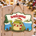 Waving frog holiday paint by numbers door hanger on a garden gate