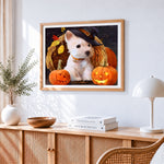 Westie with witch hat and pumpkins cross stitch artwork displayed on wall as home decor
