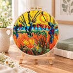 Wetland sunset scenery embroidery kit finished hoop displayed on a wooden stand as cozy tabletop decor